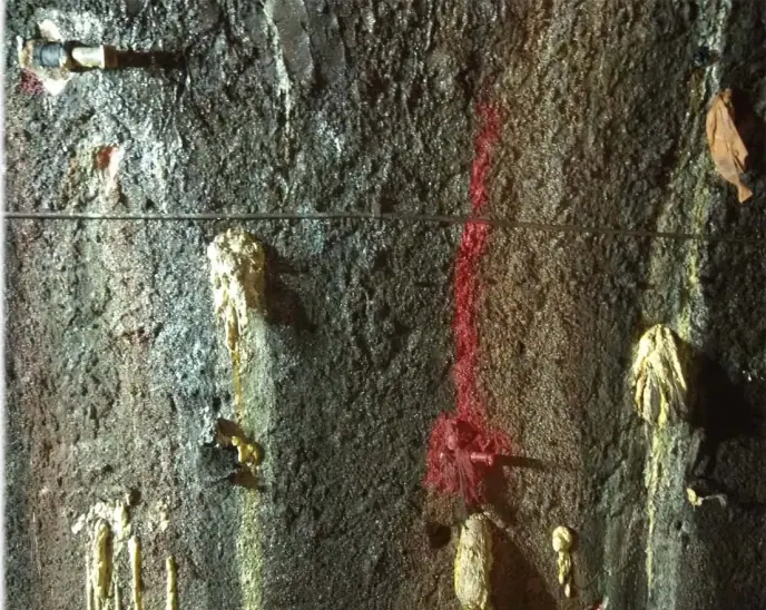 After: the same tunnel wall with injection packers in place and the seepage under control