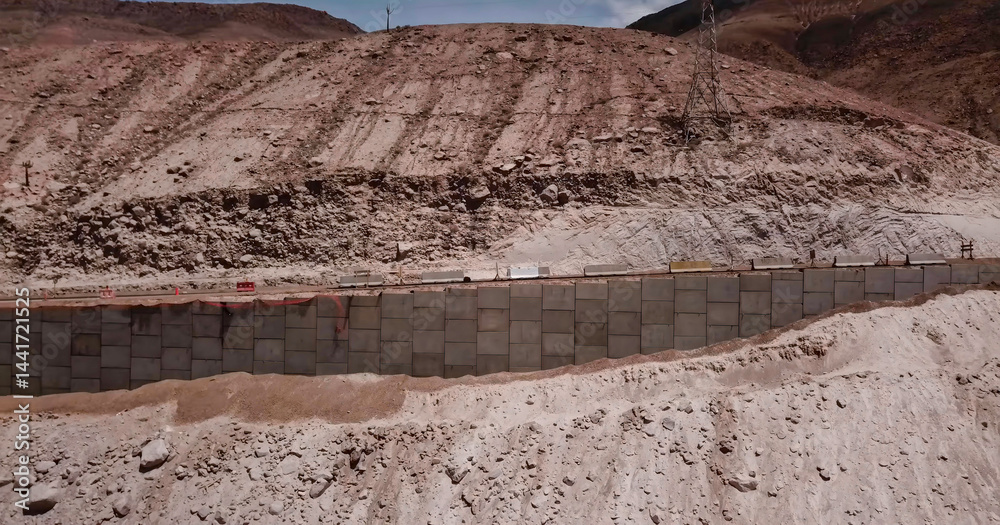 Process of placing concrete diaphragm walls to support embankments and roads